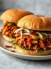 Shredded BBQ jackfruit sandwich on a bun with coleslaw