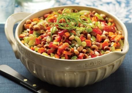 Bowl of Southern-style vegan black-eyed peas with stewed tomatoes and herbs